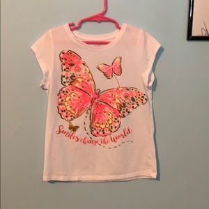 A butterfly kids top